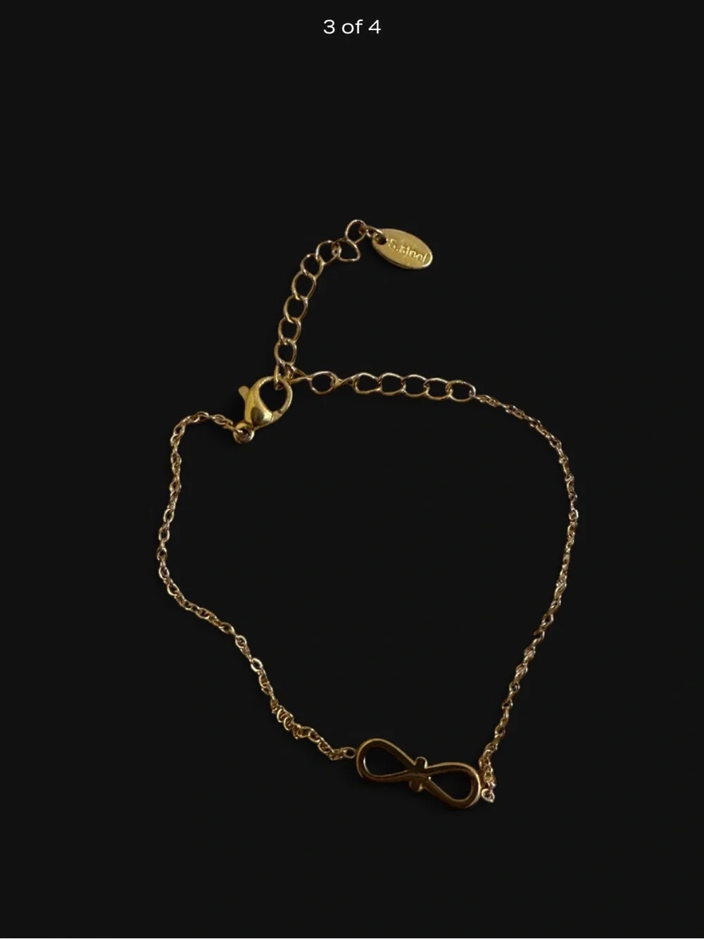 Stainless Steel Gold Infinity Bracelet With Rhinestones.